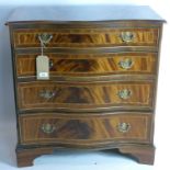 A Georgian style inlaid mahogany serpentine chest of four drawers, raised on bracket feet, H.79 W.75