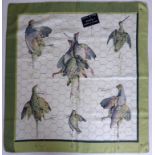 A vintage Hermes silk scarf in cream and green entitled 'Tableau De Chasse D'Hermes', Designer: