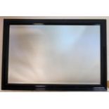 A contemporary black framed mirror with bevelled plate, 73 x 103cm