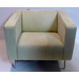 A Davison Highley suede armchair raised on chrome legs