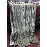 A pair of grey velvet curtains with pelmet