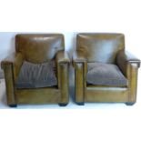 A pair of 20th century studded brown leather armchairs