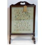 A late 19th century mahogany fire screen with embroidered panel, H.87 W.51 D.23cm