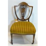 A Victorian inlaid mahogany shield back chair