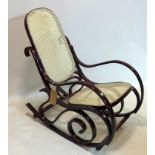 A bentwood and cane rocking chair