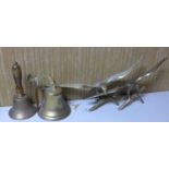 A brass bell inscribed 'Titanic', together with one other bell and two brass eagles