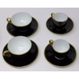Legle Limoges, black and gold rimmed porcelain collection: 2 coffee cups and 2 saucers, 2 teacups