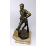 A sculpture of a footballer on sandstone base, H.44cm