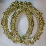 Two gilt painted cast plaster frames, decorated with putti and C-scrolls, H.55 W.42cm