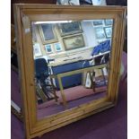 A large pine mirror with bevelled plate, 111 x 109cm