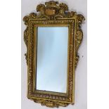 An early 20th century carved gilt wood mirror, 44 x 26cm