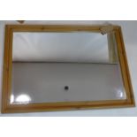 A pine mirror with bevelled plate, 73 x 105cm