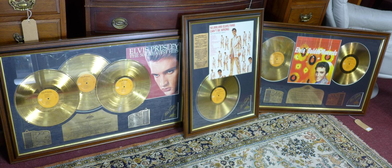 A collection of three framed 24 carat gold plated limited edition Elvis Presley records, from the