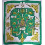 A vintage Hermes silk scarf in green, white and gold entitled 'Etriers', circa 1970's, Designer:
