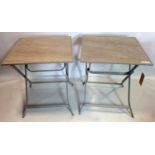 A pair of folding tables with tile tops, H.74 W.63 D.63cm