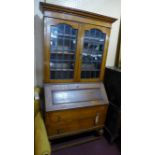 An early 20th century oak bureau bookcase, H.192 W.92 D.45cm