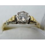An 18ct yellow gold and platinum diamond solitaire ring