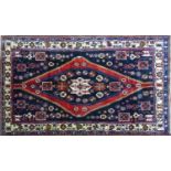 A North West Persian Zanjan rug, central diamond medallion with repeating petal motifs on a black