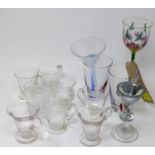 An assorted collection of glasses, to include water glasses, drinks glasses, glass funnel, and a