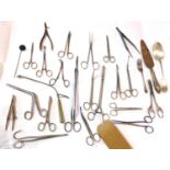 A collection of medical scissors, together with a dentist's mirror, silver plated spoon, cake slice,