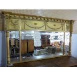 A Regency gilt overmantle panelled mirror, three bevelled glass plates, decorated with torcheres,