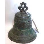 An antique bronze bell decorated with Jesus on cross and swags, H.21cm