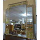 A 19th century giltwood overmantle mirror, having three glass plates and floral decorated frame, H.