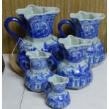 A set of five Ironstone china blue and white jugs of graduating size