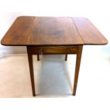 An early 19th century mahogany pembroke table, with single drawer raised on tapered legs, H.65 W.