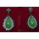 A pair of yellow gold large drop earrings set with green jade cabochons framed with onyx and