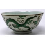 A 19th century Chinese porcelain bowl in the famille verte palette decorated to the exterior with