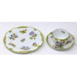 A Herend porcelain trio, cup, saucer and plate
