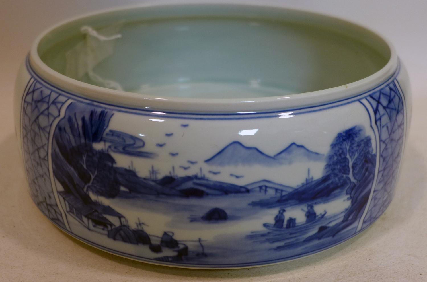 A Chinese, hand-painted blue and white porcelain brush washer decorated to the outside with 2