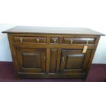 An 18th century oak sideboard with three drawers over two cupboard doors, H.94 W.150 D.62cm