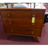 A 20th century stained pine chest of three graduating drawers, raised on 4 splayed feet, H.85 W.89