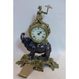A Brevettato bronze and gilt metal clock in the form of a figure on a elephant, H.41cm