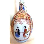 A Japanese vase converted to a lamp base, decorated with vignettes of couples in a garden landscapes