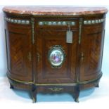 A Louis XV style French walnut sideboard, with marble top, gilt metal mounts and porcelain