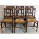 A set of six Art & Crafts mahogany dining chairs with rush seats