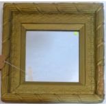 A gilt wall mirror, (major chips to frame), with rope design and floral border, 45 x 45cm