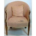 A 19th century upholstered armchair with carved oak frame