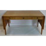 Hans Wegner, Danish, an oak Drop-Leaf Table/Desk, three drawers raised on tapered legs, stamped, H.