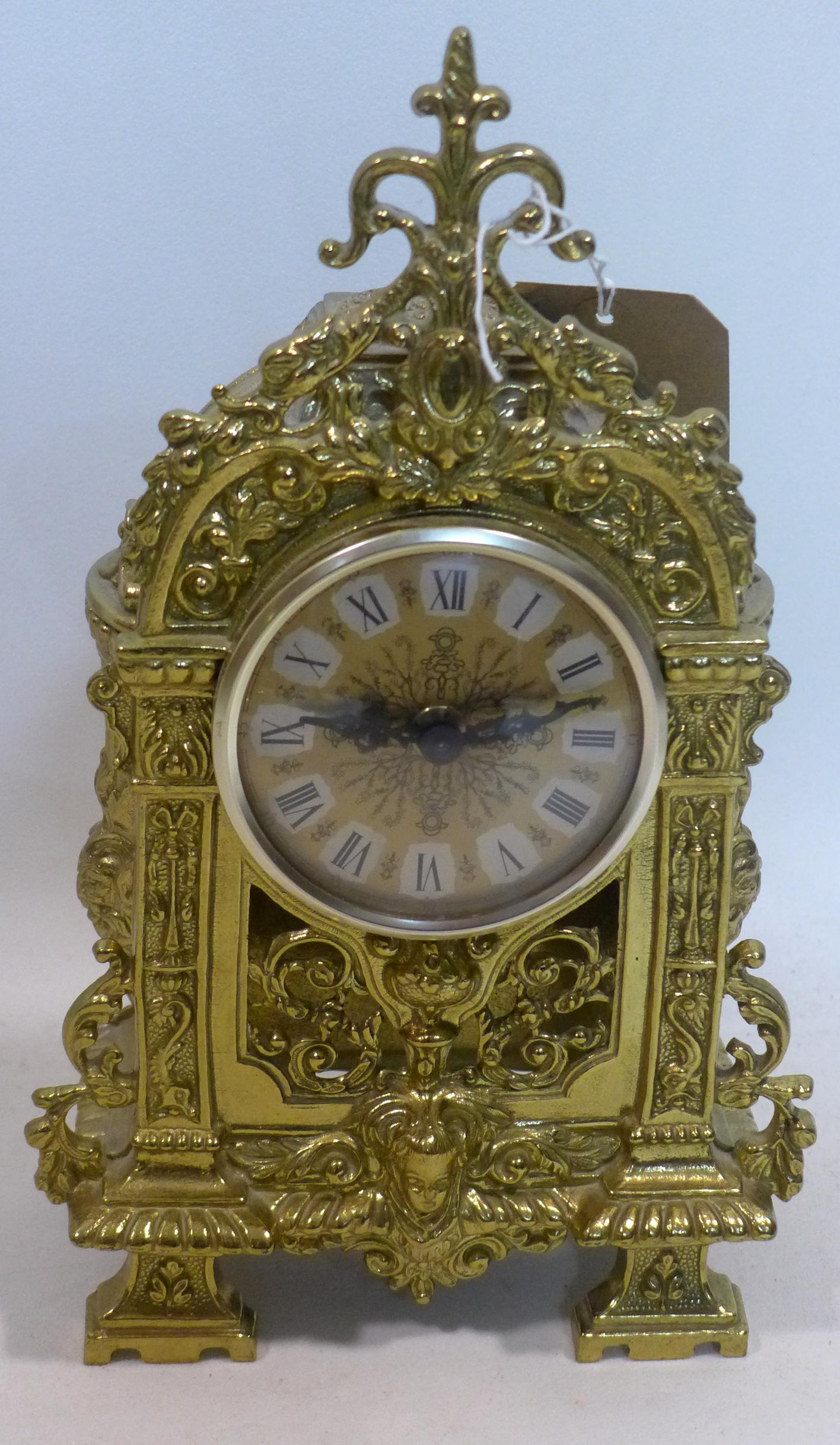 A gilt metal mantle clock, battery operated