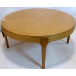 A large circular teak coffee table, H.41 D.88cm