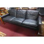 A 20th century Danish Hans Olsen style black leather sofa