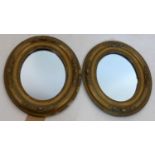A pair of early 20th century oval gilt wood mirrors, 32 x 27cm