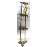 An Art Nouveau brass wall hanging letter rack, H.98 W.20cm