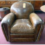 An Art Deco style brown leather armchair