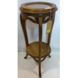 An early 20th century Continental walnut jardiniere stand with marble top, H.79cm