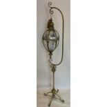 A gilt metal storm lantern on stand, H.163cm